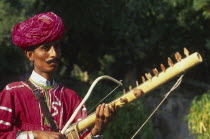 Musician with Tambora instrument.
