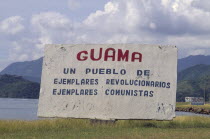 Sign welcoming people to the town  including revolutionary writings.