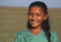 A Llanera girl wearing a green top with white dots.