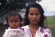 A Llanera woman holding a child.