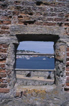 St Peter Port. Castle Cornet. View through battlement window towards St Sampson.