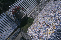 St Andrews. Les Vauxbelets.The Little Chapel. Detail of china fragments with an Urn next to white fence.Modelled on the Shrine at Lourdes. Made from china pottery and fragments of sea shells. Asia Ch...