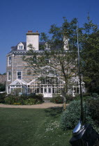 St Martins. Sausmarez Manor. View from sculpture garden towards side of house.