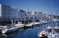 St Peter Port. Victoria Marina yachts and quayside buildings.