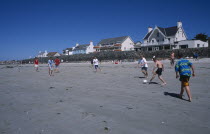 Castel. Cobo Bay. Young men playing football on sandy beach Beaches Resort Sand Sandy Seaside Shore Tourism