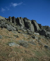 Gritstone craggs with rock climbers.