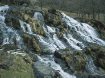 Waterfall cascading over rocks in stream flowing south east from Snowdon to Nant Gwynant