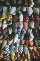Display of embroidered and decorated leather slippers or babouches. Fez