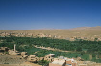 Town buildings overlooking agricultural land and oasis.Tinerhir Tinghir
