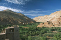 Kasbah and village overlooking fertile valley.