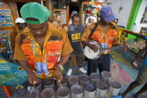 Miniature steel drum pan player and band playing at a roadside bar during Easterval Easter Carnival in Clifton