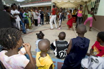 Children watching other children dancing to a sound system at the Easterval Easter Carnival in Clifton
