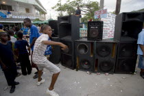 Boy dancing beside sound system at Easterval Easter Carnival in Clifton