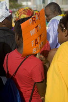 Woman carrying a religious placard amongst the Baptist congregation in Clifton at Easter morning harbourside service for those lost at sea