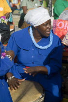 Woman playing a drum amongst the Baptist congregation in Clifton at Easter morning harbourside service for those lost at sea
