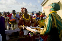 Women handing out food amongst the Baptist congregation in Clifton at Easter morning harbourside service for those lost at sea