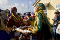 Women handing out food amongst the Baptist congregation in Clifton at Easter morning harbourside service for those lost at sea