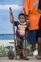 Young boy with a balloon in his t-shirt at the Easterval Easter Carnival in Clifton