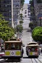 View of cable cars on Taylor Street with view up to Nob Hill beyond