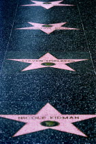 Hollywood. Pink marble and bronze stars embedded into Hollywood Boulevard sidewalk aka Hollywood walk of FameNicole KidmanSteven Spielberg