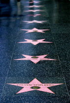 Hollywood. Pink marble and bronze stars embedded into Hollywood Boulevard sidewalk aka Hollywood walk of FameSteven Spielberg