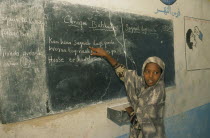 Dr Ayub Primary School.  Pupil at blackboard.