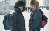 Siberian schoolboys in winter clothing.