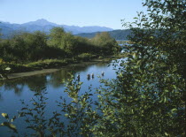 Union. View over the Skokomish River with men fishing for salmon.