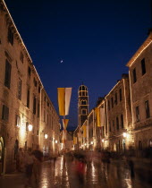 View along the Stradun toward the Franciscan Monastery illuminated at night