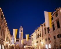 View along the Stradun toward the clocktower with Vatican flags for the papal visit June 2003