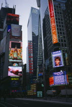 USA, New York, Manhattan, Times Square with illuminted signs and televised news feeds.