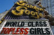 USA, Nevada, Las Vegas, sign for the Golden Goose Topless Girls club in Fremont street downtown covered area.