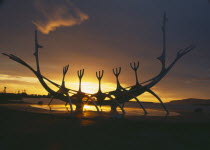 Sun Voyager or Solfar. 1971 steel Viking ship sculpture by Jon Gunnar Arnason silhouetted at sunset.