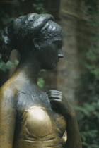 Statue of Juliet outside Casa di Giulietta or Juliets House at Number Twenty Seven Via Cappello.  Detail of head and shoulders with raised hand.