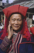 Portrait of Zao minority woman with her hand to her face