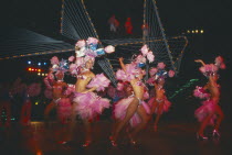 Female Club Tropicana dancers on stage with singers on overhead walkway