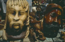 Wooden carved statues on market stall