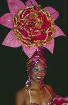 Tropicana Club female dancer in pink costume with pink head-dress in the shape of a flower