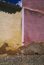 Detail of red and yellow walls split by white line