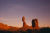 Balanced Rock formation seen in red evening light