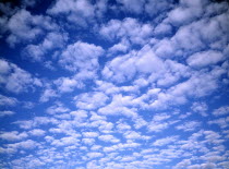 White fluffy clouds in blue sky.