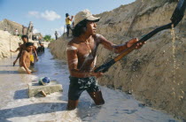 Men digging sewers with shovels