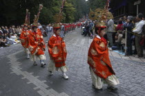 Toshogu shrine  Toshogu grand procession  1 000 samurai procession  boys  about 12 years old  in Edo era costumes  headresses of zodiac signs  crowds watching.
