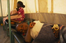 Child on bed in emergency Cholera treatment tent in the Kisumu Ndogo slum area