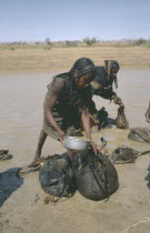Kababish tribeswomen collecting water.