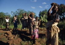 Bwanali village development committee road building project.  Women building access road.