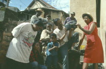 Group listening to wind up radio.