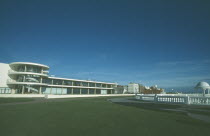 De La Warr Pavilion. Exterior view from seafront over grass towards back entrance with staircase section and terracing.Art Deco building built by the Earl of De La Warr in 1935 recently restored in...