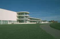De La Warr Pavilion. Exterior view over grass towards back entrance with staircase section and terracing.Art Deco building built by the Earl of De La Warr in 1935 recently restored in 2005 European...