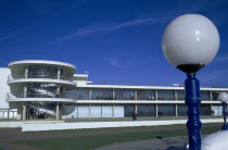De La Warr Pavilion. Exterior view over grass from the seafront terrace with globe shaped lamp. Art Deco building built by the Earl Of De La Warr in 1935 Designed by Erich Mendelsohn and Serge Cherma...